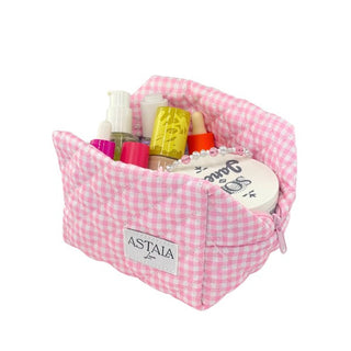 Pink gingham cosmetic organiser bag holding skincare items available for sale at Astla Luna in Australia