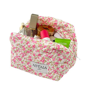 Pink floral cosmetic organiser bag holding skincare and makeup products available for sale at Astla Luna in Australia