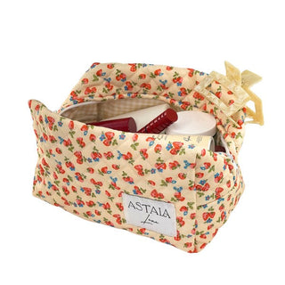 Cream floral cosmetic organiser bag holding makeup products available for sale at Astala Luna in Australia